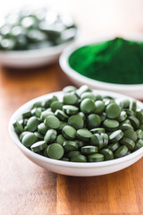 Green chlorella pills or green barley pills.