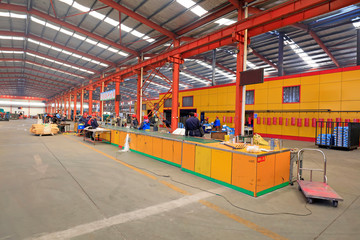 workers in the steel spade production line, in a factory, Tangshan City, Hebei, China