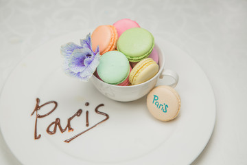 sweet french macaroon on white isolated white background. fly falling sweet macaroni