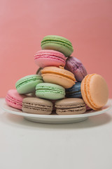 sweet french macaroon on white isolated white background. fly falling sweet macaroni