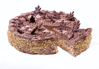 Chocolate cake slice with curl on white background