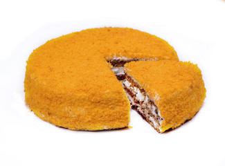 carrot cake with walnuts, prunes and dried apricots on a dark wood background. tinting. selective focus. One piece