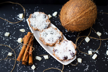 coconut muffins on a black background