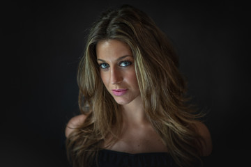 studio portrait of attractive woman