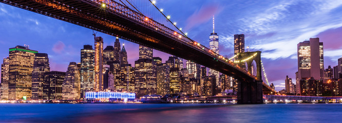 Brooklyn Bridge with skyscrapers background. New York City, USA. Brooklyn Bridge is linking Lower Manhattan to Brooklyn.. - obrazy, fototapety, plakaty
