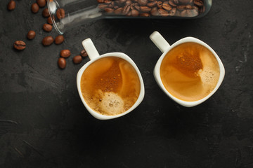 Obraz na płótnie Canvas coffee freshly brewed in a white cup serving of beverage (coffee grain). food. top.copy save