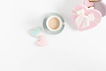 Composition Valentine's Day. Cup of coffee, Valentine cookies on white background. Flat lay, top view, copy space 