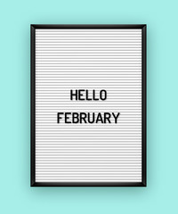 Hello February welcome quote on white letterboard with black plastic letters