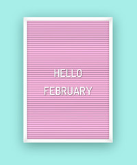 Hello February welcome quote on pink letterboard with white plastic letters