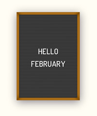 Hello February welcome quote on black letterboard with white plastic letters