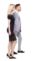 Side view of two walking business people.