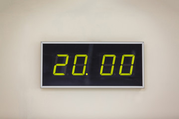 Black digital clock on a white background