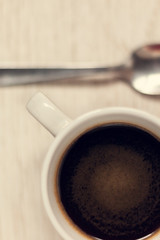 Obraz na płótnie Canvas Cup of coffee and spoon