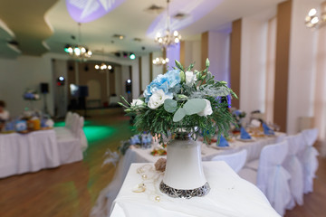 stylish interior of the wedding hall. festive decorated restaurant hall  beautiful wedding decor in the restaurant. festive serviced table in the restaurant.