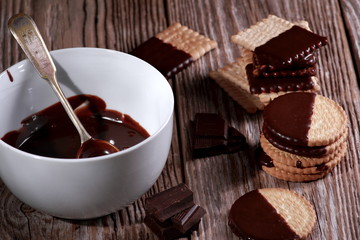 Bowl with hot chocolate and sweet milk biscuits