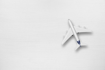 Model of airliner on white table