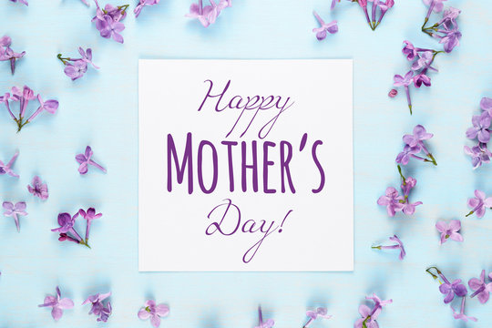 Mother's day card with lilac flowers on blue background