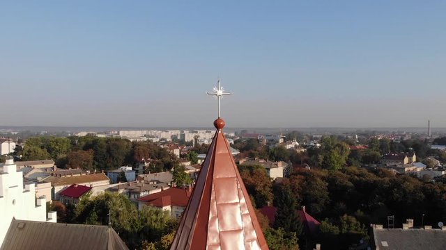 Aerial view of medieval Bell Tower of St. Bartholomew church Landscape of Drohobych city. Smooth pan around dome of bell tower
