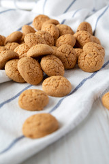 Homemade almond cookies on cloth, side view. Selective focus.