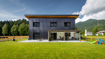 frontal view to solar sun house with panels on front