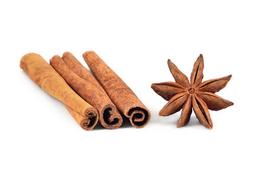 Condiment. Cinnamon sticks and star-anise on white background. Isolated, closeup.