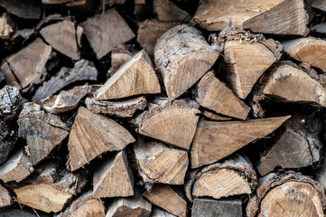 Folded stacks of Firewood. Preparation of firewood for the winter.