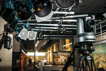 video camera on a tripod crane in a television studio