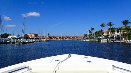 A day boating at a marina in Florida on a beautiful clear blue sky day