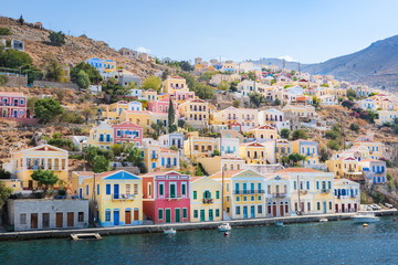 Colorful neoclassical houses in harbor town of Symi (Symi Island, Greece)