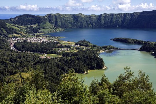 View from Miradouro da Vista do Rei into the volcanic crater Caldera Sete Cidades with the crater lakes Lagoa Verde and Lago Azul, behind the village Sete Cidades, Sao Miguel, Azores, Portugal, Europe
