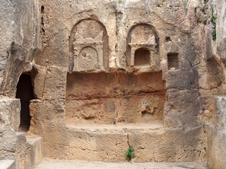 detail of carved stone tomb in the temple of the kings area in paphos cyprus