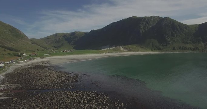 Hoddevik beach view from drone. Pull out shot over the rocky beach.