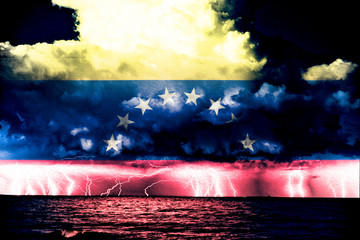 Conflict between USA and Venezuela, conceptuall image witth a sea thunderstorm and the flag of...
