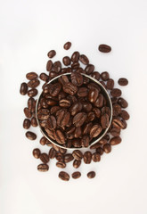 Several coffee beans on a white background