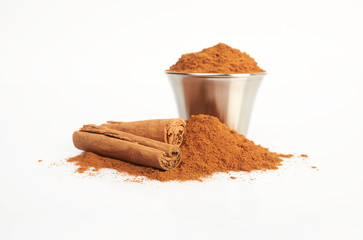 Cinnamon sticks and powder isolated on white background