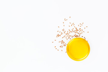 Flax oil and flax seeds isolated on white background. Flat lay. Top view