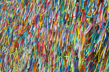 The railings of the Church of Senhor do Bonfim in Salvador, Brazil, adorned with wish ribbons left during the Festa do Bonfim celebrations.