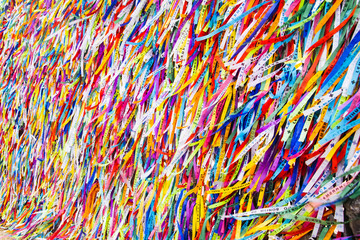 The railings of the Church of Senhor do Bonfim in Salvador, Brazil, adorned with wish ribbons left during the Festa do Bonfim celebrations.