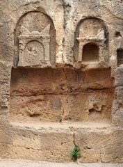 detail of carved stone tomb in the temple of the kings area in paphos cyprus