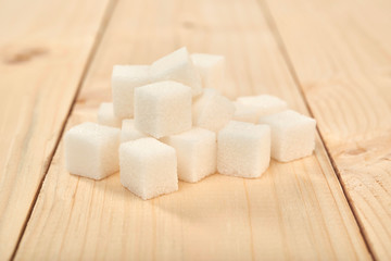 sugar cubes on a wooden table