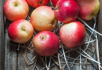 Fresh organic ripe red apples with water drops on wooden background, Apple fruit concept