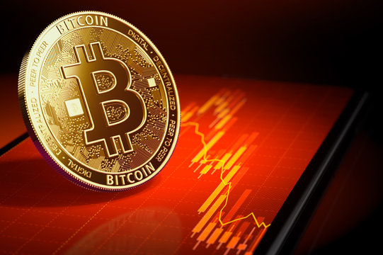 Golden bitcoin standing on a screen with red downtrend diagram. Bitcoin price falling concept. 3D rendering