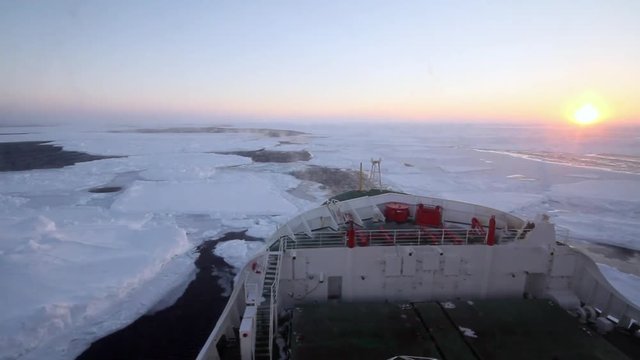 Research icebreaker cruising at packed ice in Weddell Sea of Antarctica during winter