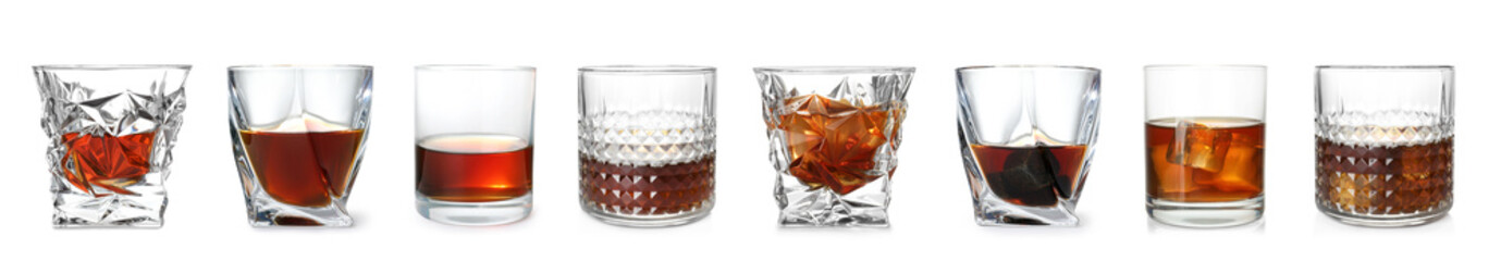 Set of glasses with expensive whiskey on white background
