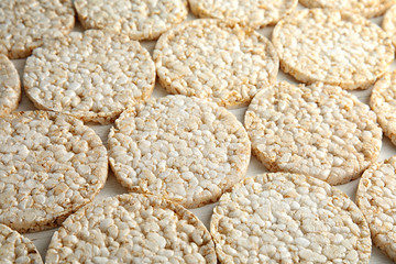 Crunchy rice cakes on white wooden background