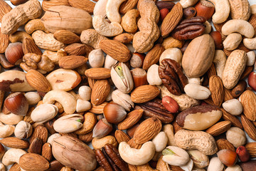 Organic mixed nuts as background, top view