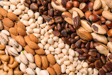 Organic mixed nuts as background, top view