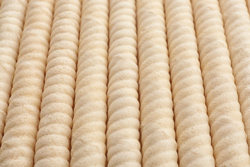 Delicious wafer rolls as background, closeup. Sweet food
