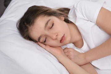 Fototapeta na wymiar Beautiful little girl sleeping in bed at home