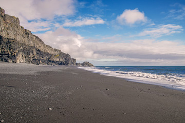 View of Reynisfjara black sand beach on a sunny day.Vik.Southern Iceland